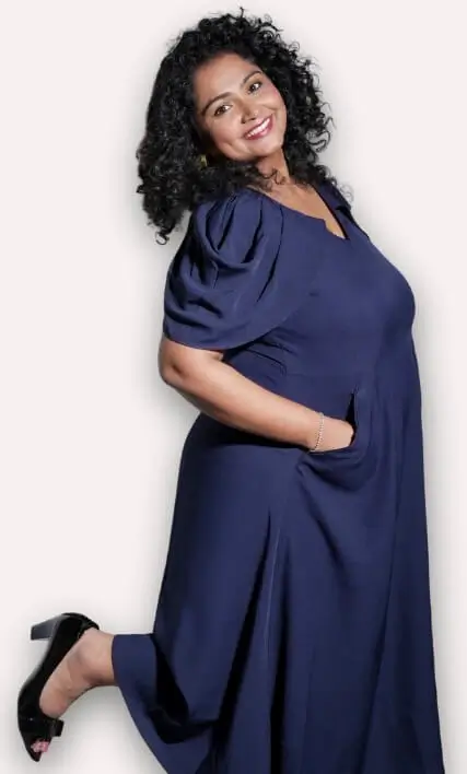 Woman in navy dress smiling